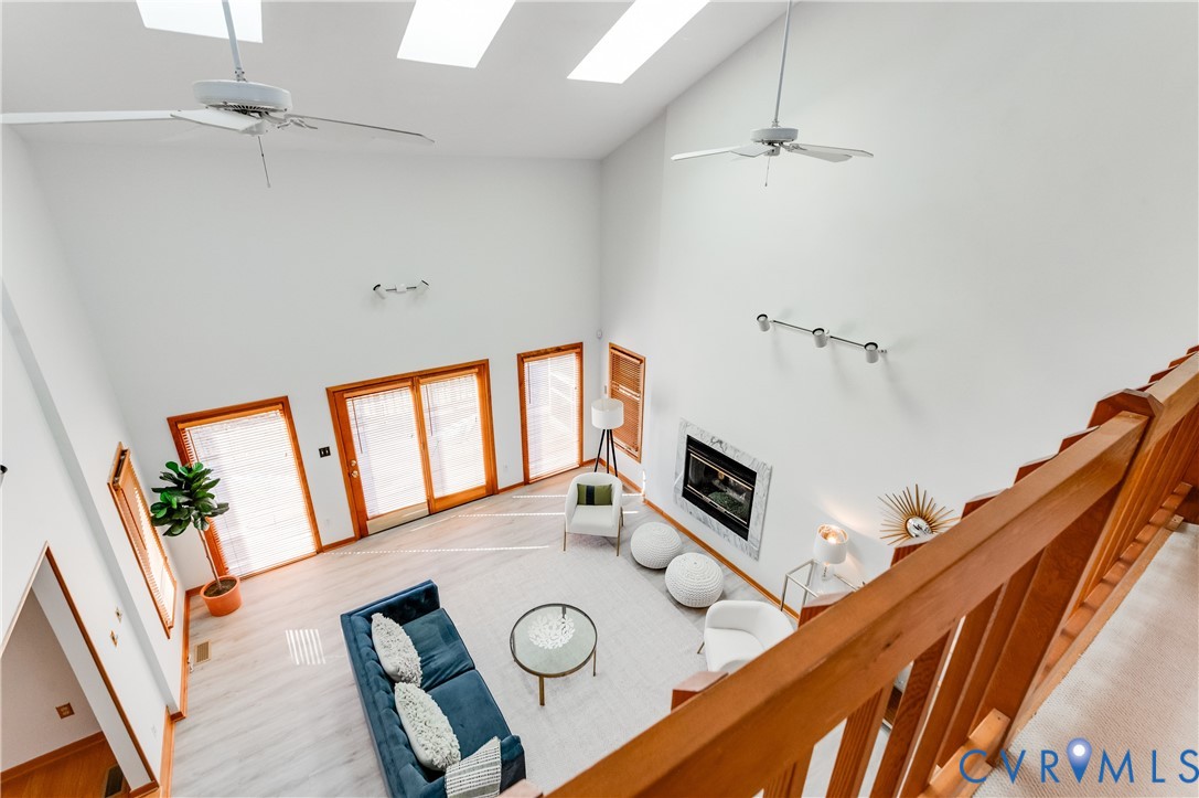 14722 Swift Water Road Chesterfield, VA 23838 - Photo 36 of 50 a living room with furniture and wooden floor