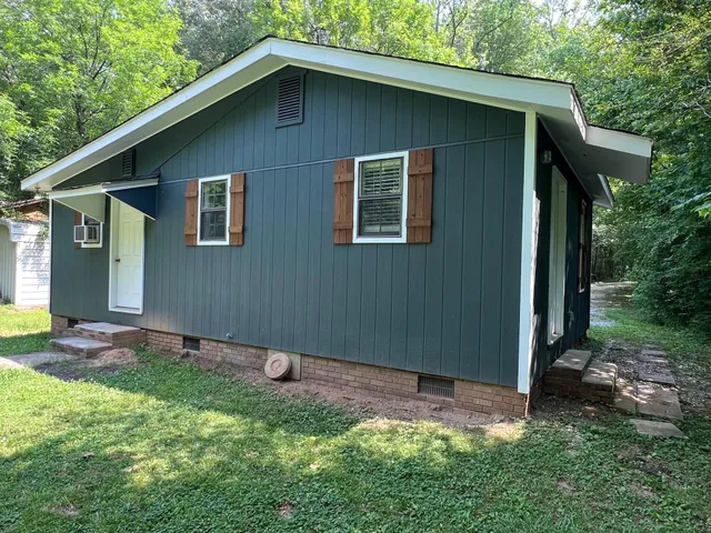 a backyard of a house with lots of green space