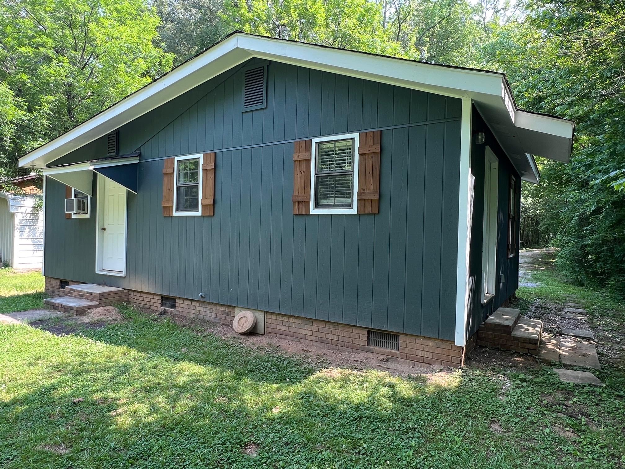 a backyard of a house with lots of green space