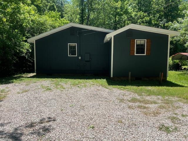 90 Double Springs Loop Savannah, TN 38372 - Photo 16 of 31 a front view of a house with garden
