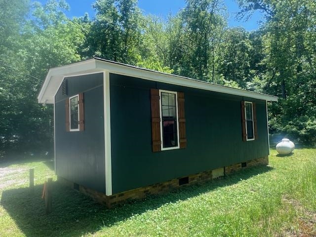90 Double Springs Loop Savannah, TN 38372 - Photo 17 of 31 a backyard of a house with lots of green space