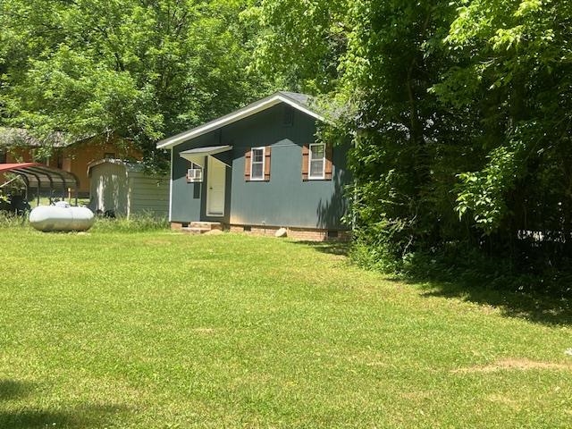 90 Double Springs Loop Savannah, TN 38372 - Photo 18 of 31 a house view with a outdoor space