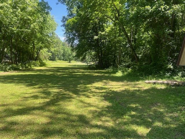 90 Double Springs Loop Savannah, TN 38372 - Photo 22 of 31 a yard with swimming pool and green space