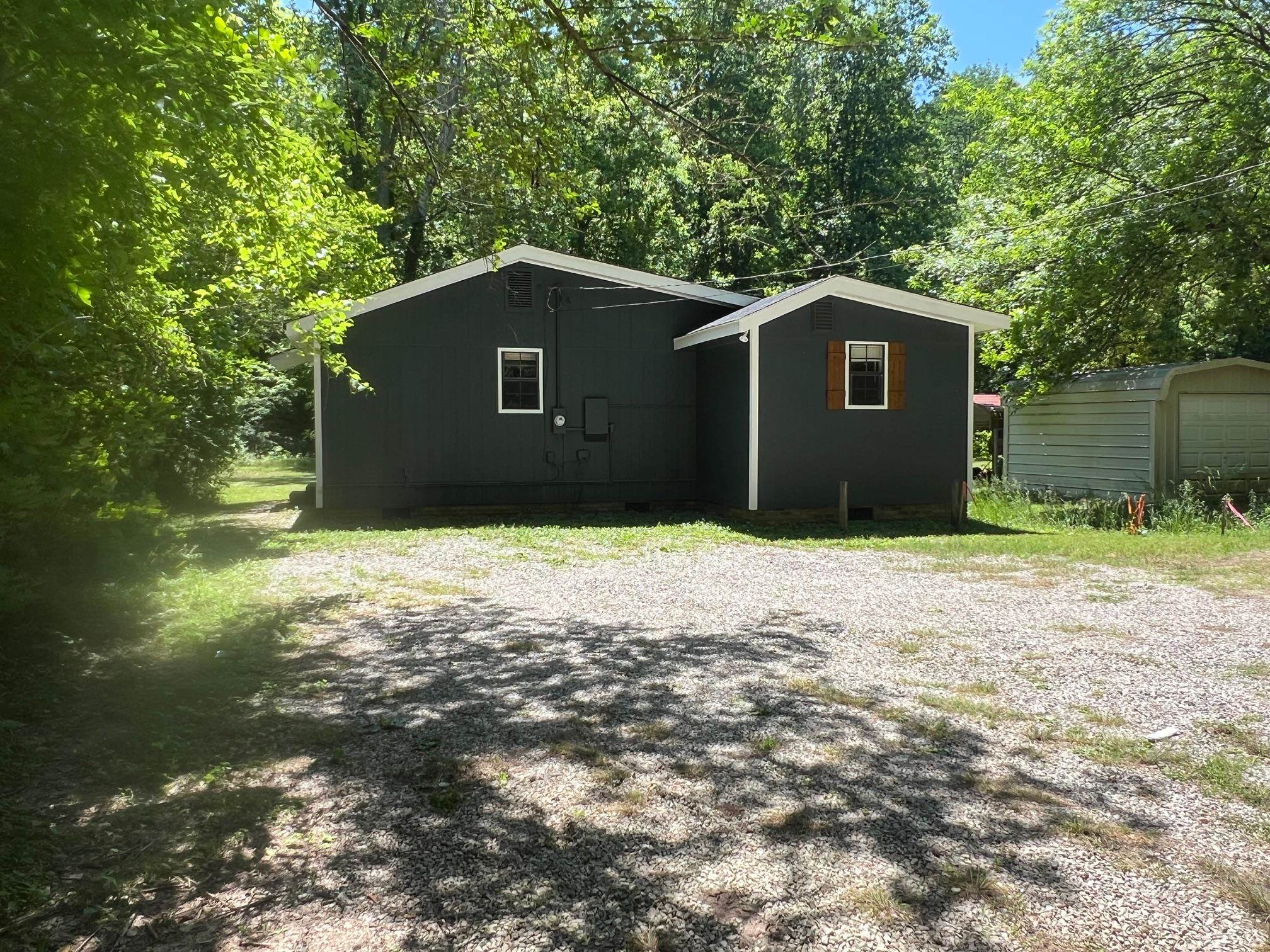 90 Double Springs Loop Savannah, TN 38372 - Photo 29 of 31 a house that has a tree in front of it