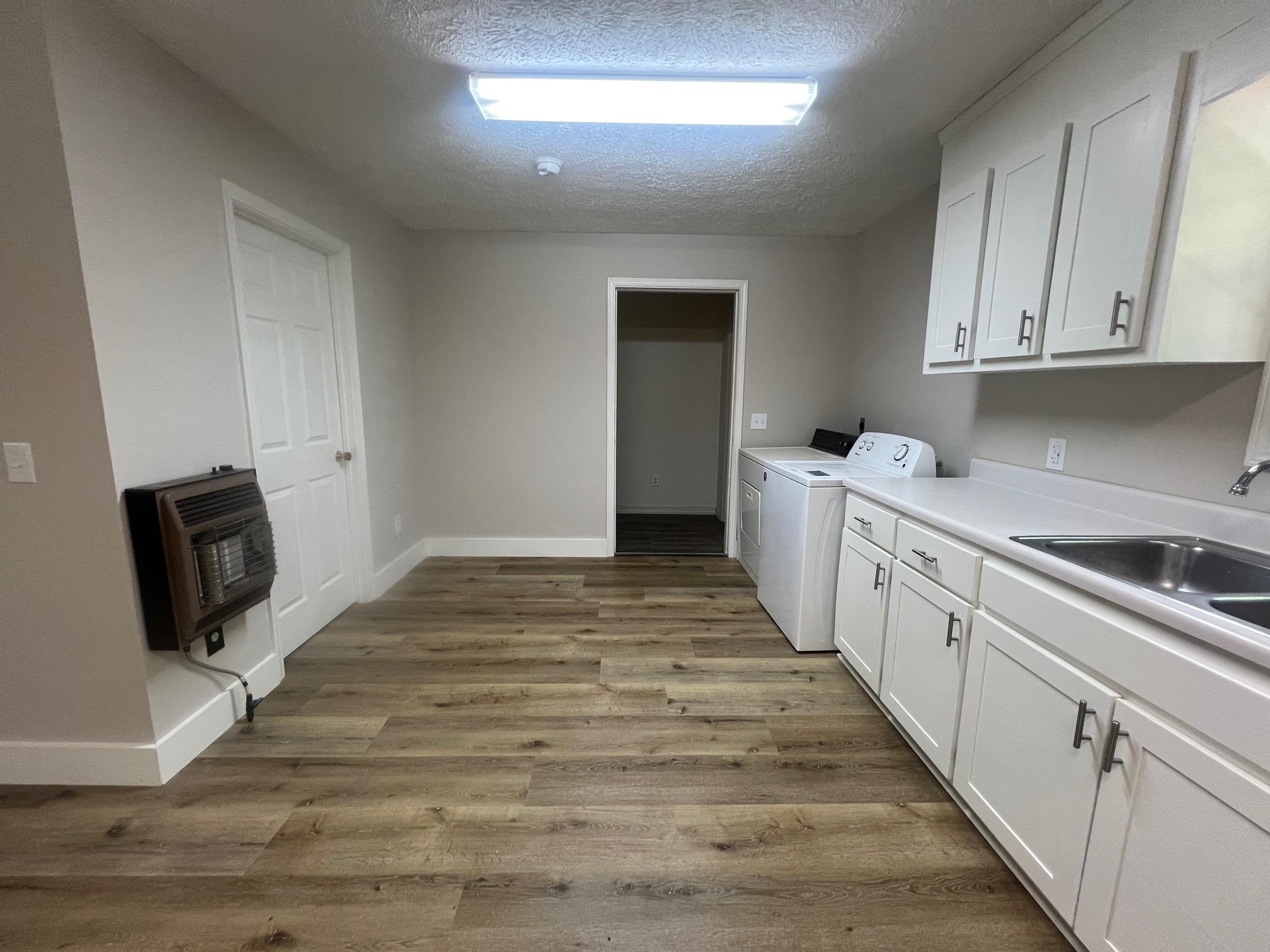 90 Double Springs Loop Savannah, TN 38372 - Photo 3 of 31 a room with a bed and cabinets