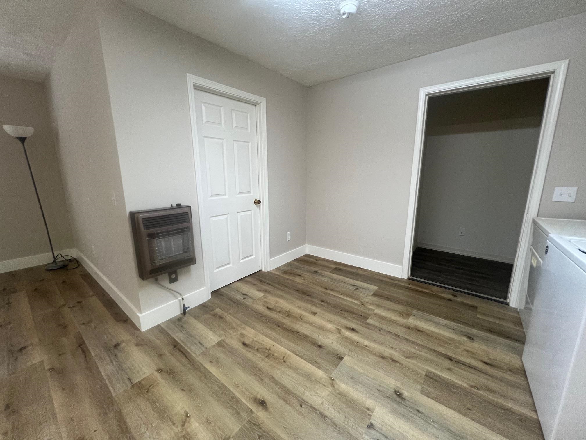 90 Double Springs Loop Savannah, TN 38372 - Photo 6 of 31 a view of a livingroom with wooden floor and a flat screen tv