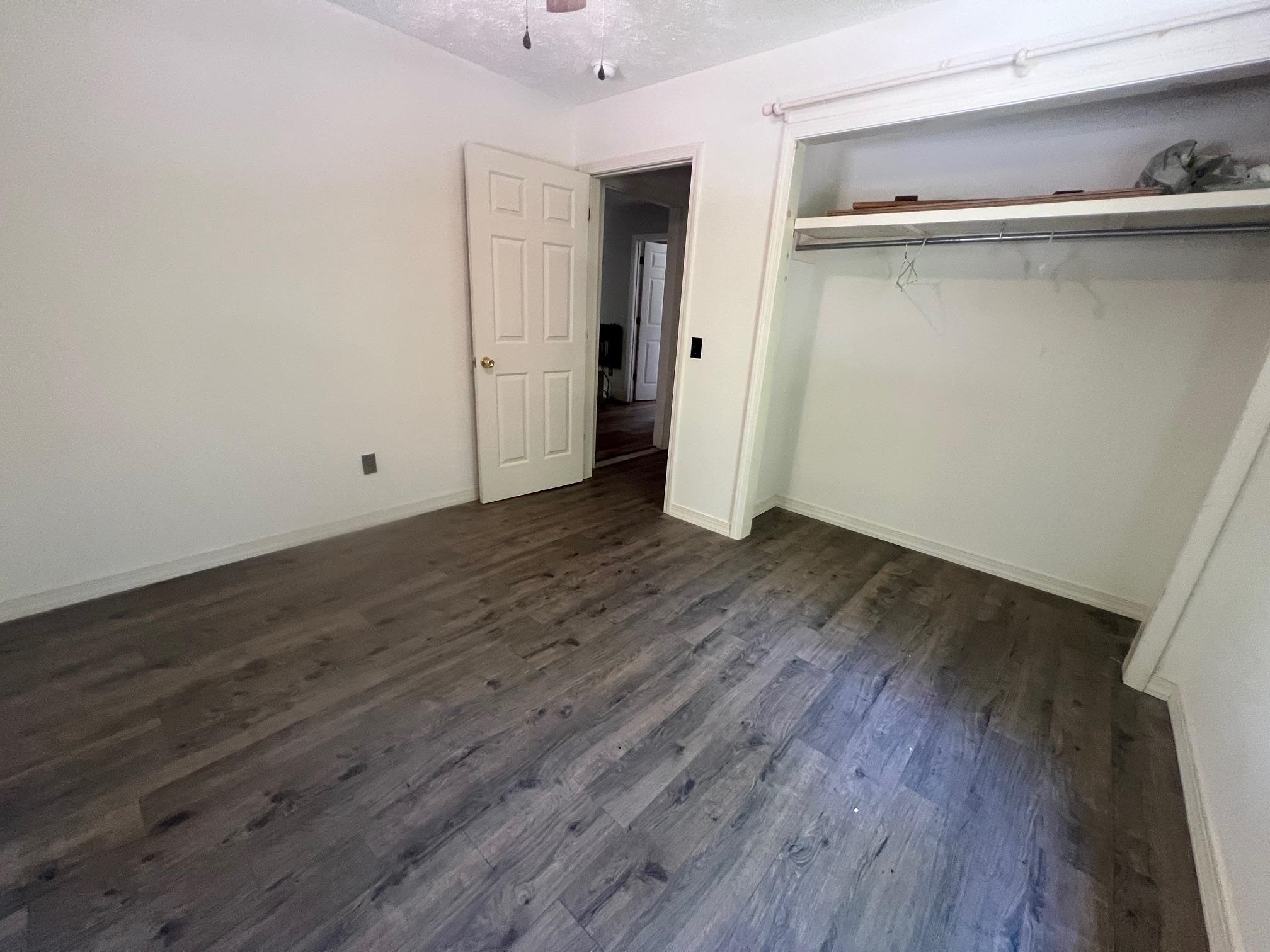 90 Double Springs Loop Savannah, TN 38372 - Photo 10 of 31 an empty room with wooden floor and a sink