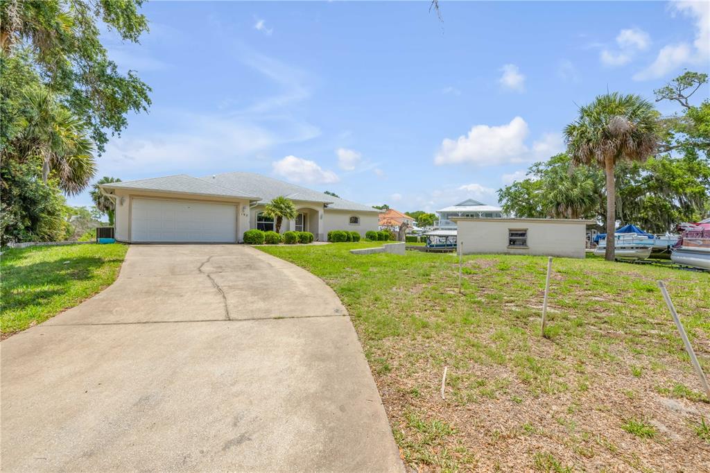 192 Azalea Road Edgewater, FL 32141 - Photo 56 of 94 a front view of house with yard