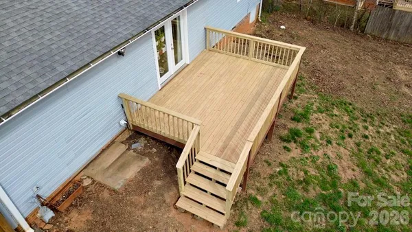 a view of stairs with wooden floor and fence
