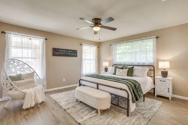 a bedroom with a bed and window