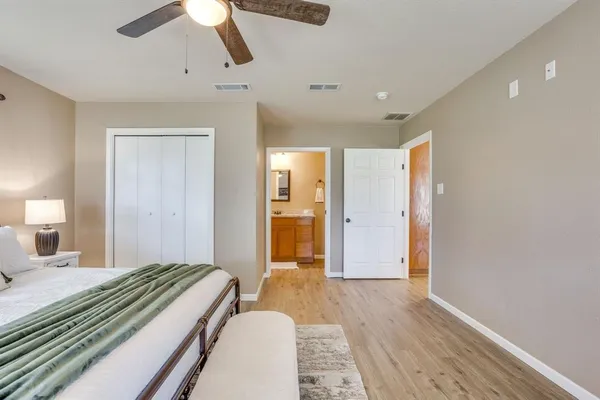 a bedroom with a bed and a walk in closet