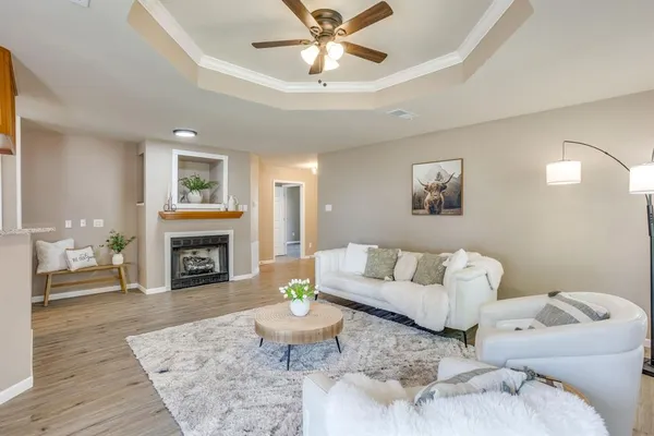 a living room with furniture and a fireplace