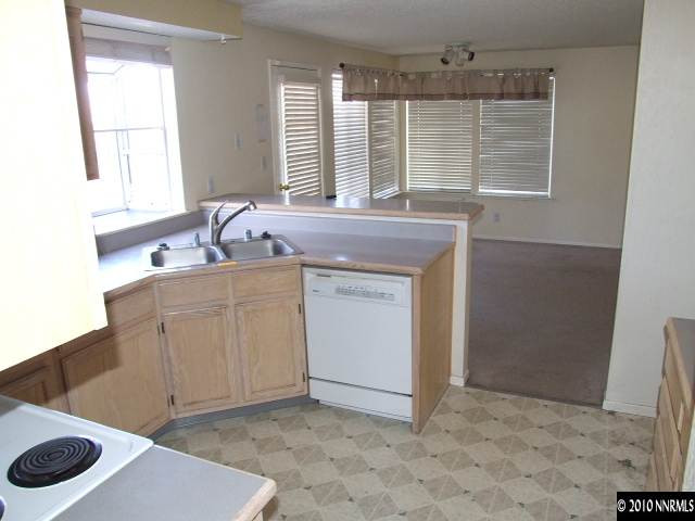 6377 Moon Ridge Terrace Reno, NV 89523 - Photo 3 of 7 a kitchen with a sink cabinets and window