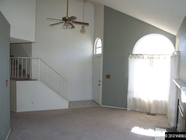 6377 Moon Ridge Terrace Reno, NV 89523 - Photo 4 of 7 an empty room with fan and windows