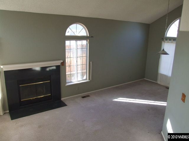 6377 Moon Ridge Terrace Reno, NV 89523 - Photo 7 of 7 a view of empty room with a fireplace