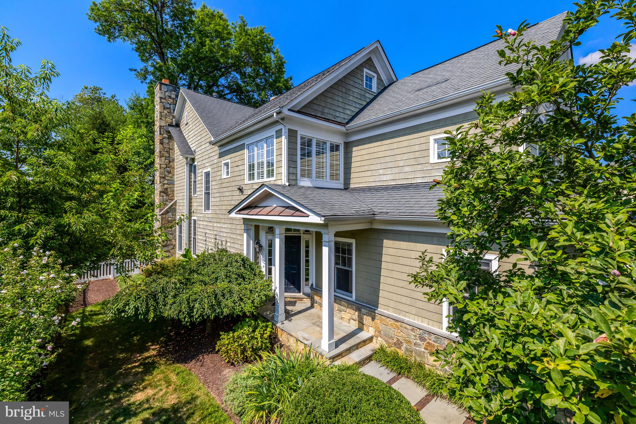 1519 Pathfinder Lane McLean, VA 22101 - Photo 1 of 54 a front view of a house with a garden