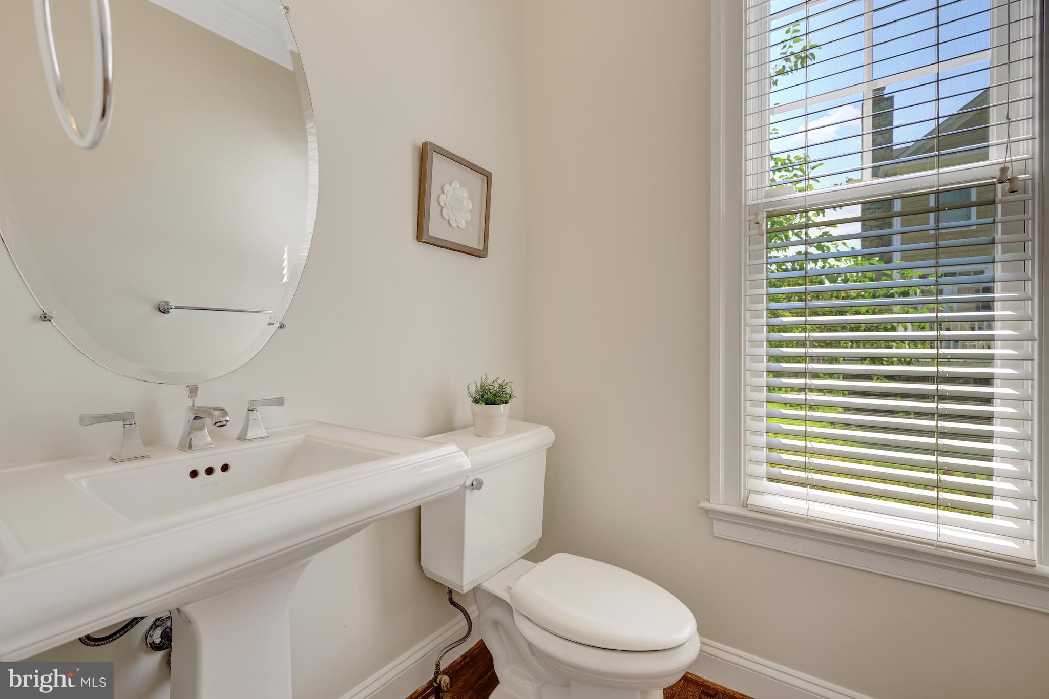 1519 Pathfinder Lane McLean, VA 22101 - Photo 12 of 54 a bathroom with a sink a toilet and a mirror