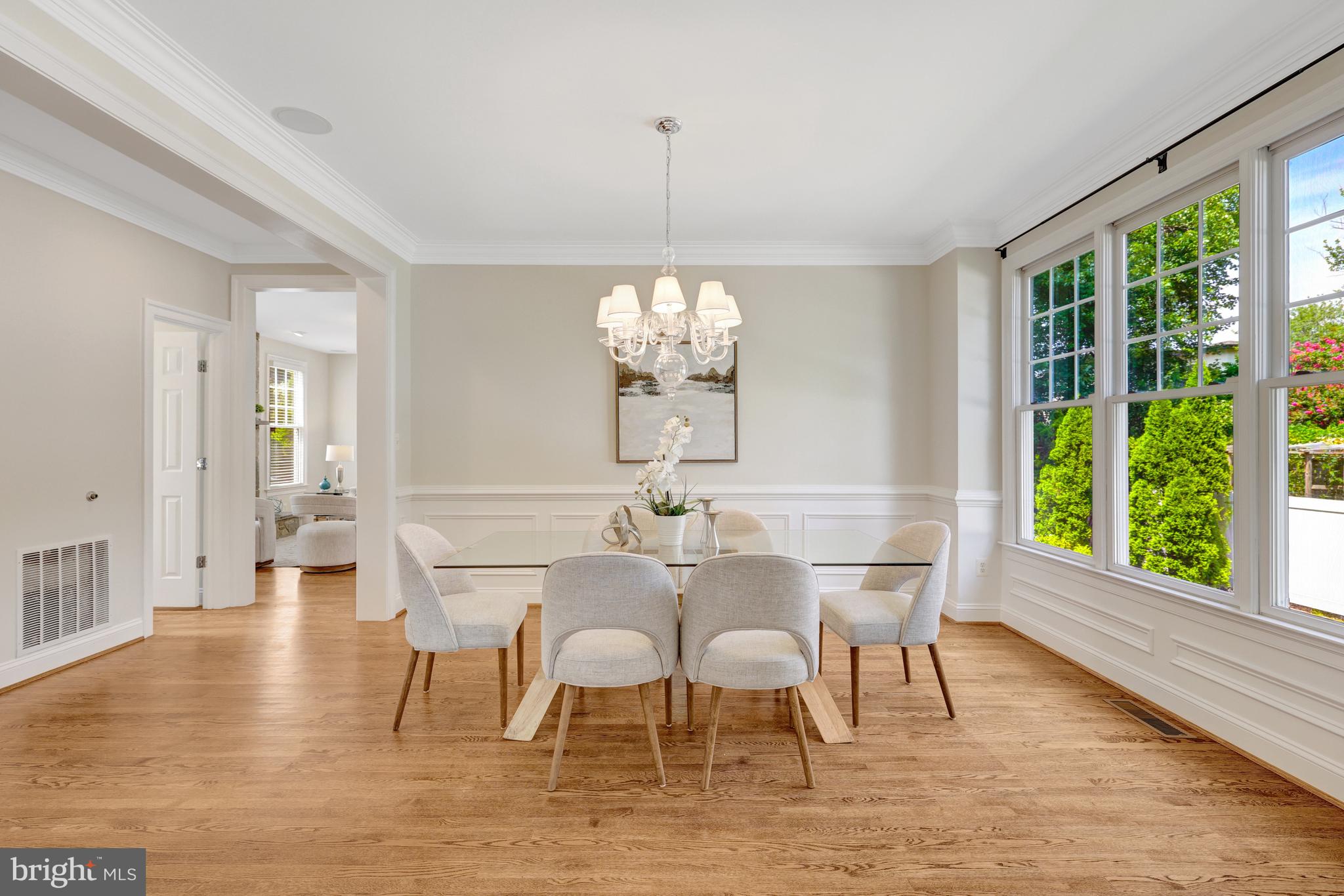 1519 Pathfinder Lane McLean, VA 22101 - Photo 13 of 54 a view of a dining room with furniture a chandelier and wooden floor