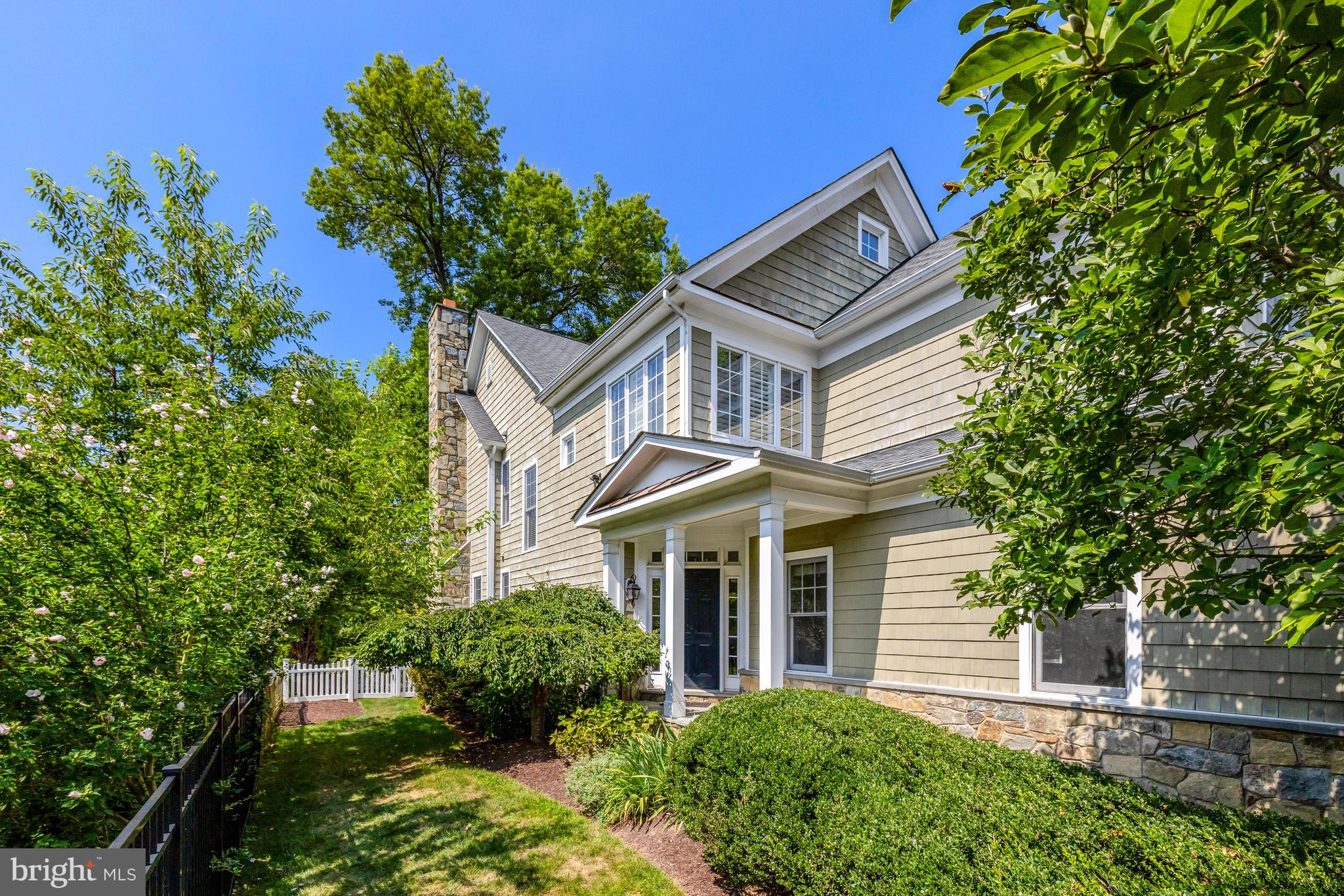 1519 Pathfinder Lane McLean, VA 22101 - Photo 2 of 54 a front view of a house with a garden