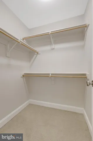 a bath tub sitting in a bathroom next to a window