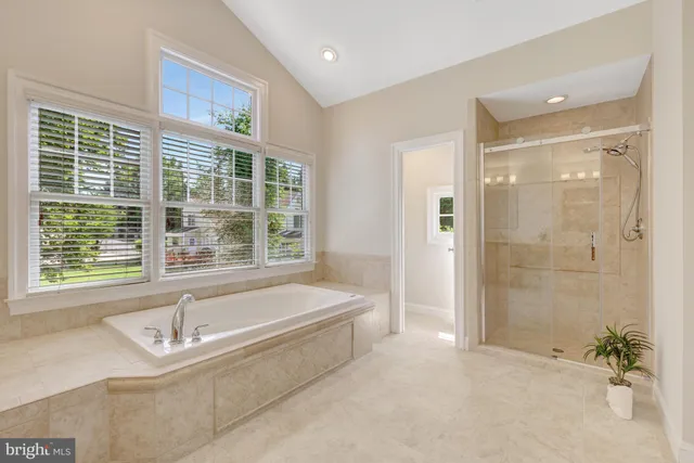 a view of an empty room with a ceiling fan