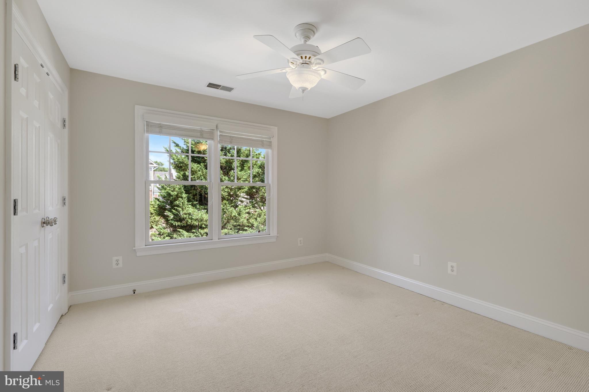 1519 Pathfinder Lane McLean, VA 22101 - Photo 34 of 54 an empty room with a window and a fan