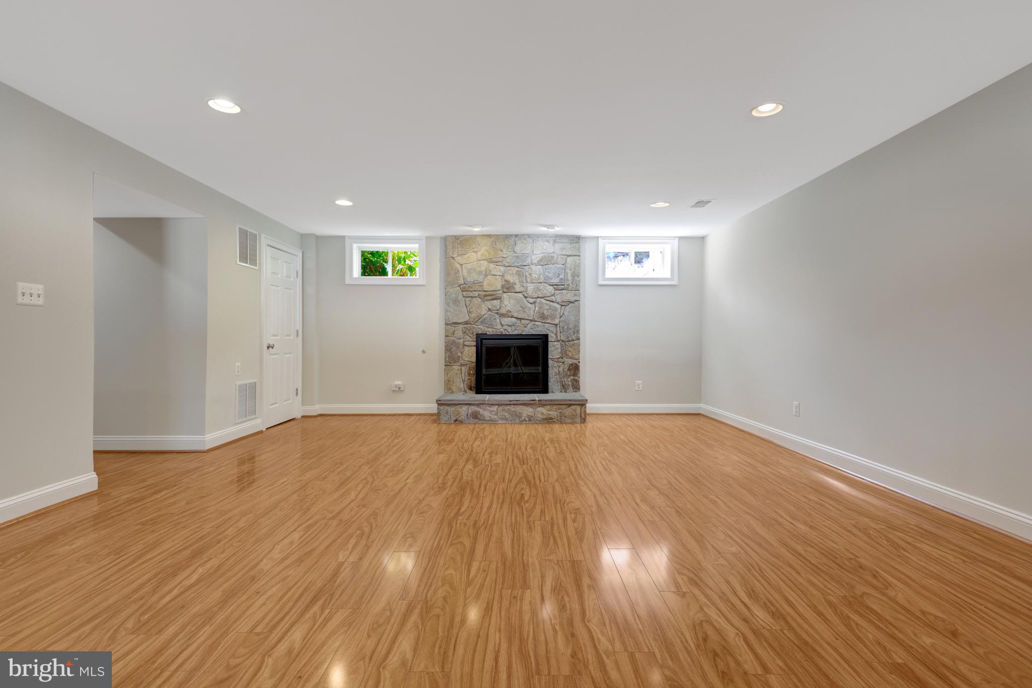 1519 Pathfinder Lane McLean, VA 22101 - Photo 45 of 54 a view of empty room with wooden floor and fireplace