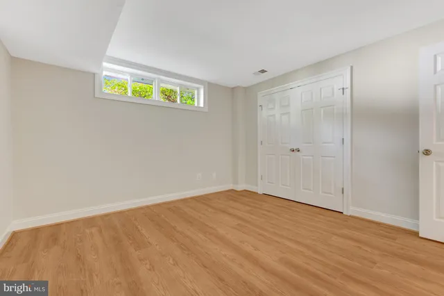 a view of a house with backyard sitting area and garden