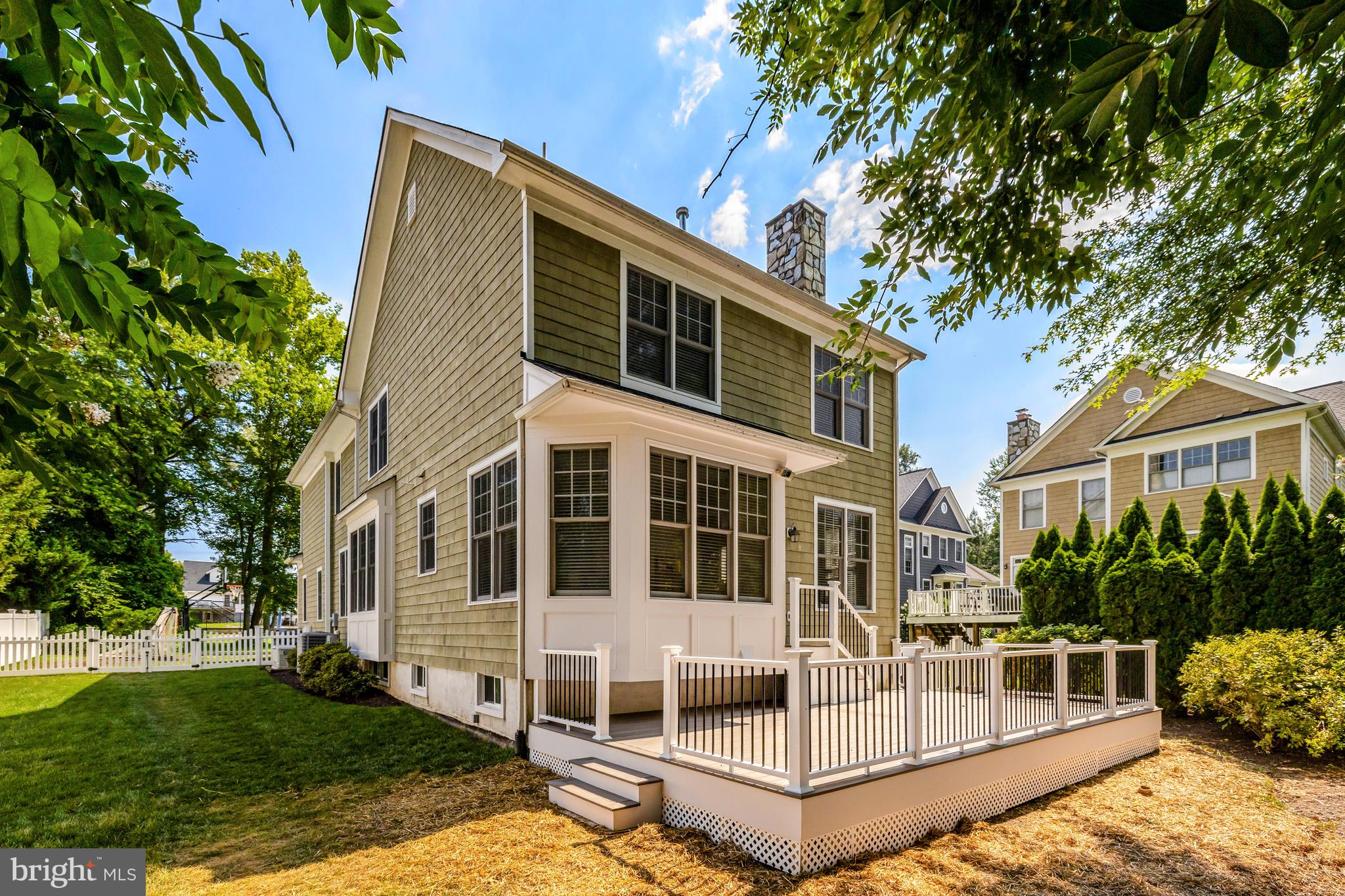1519 Pathfinder Lane McLean, VA 22101 - Photo 50 of 54 a view of a white house with a big yard and large trees