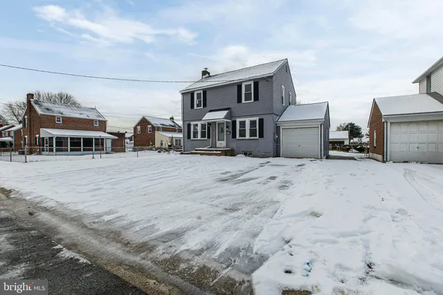 a view of a building with a snow in the background
