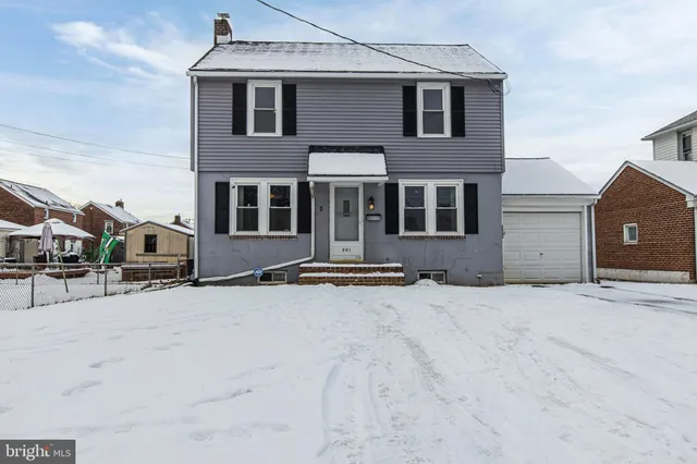 a front view of a house with yard