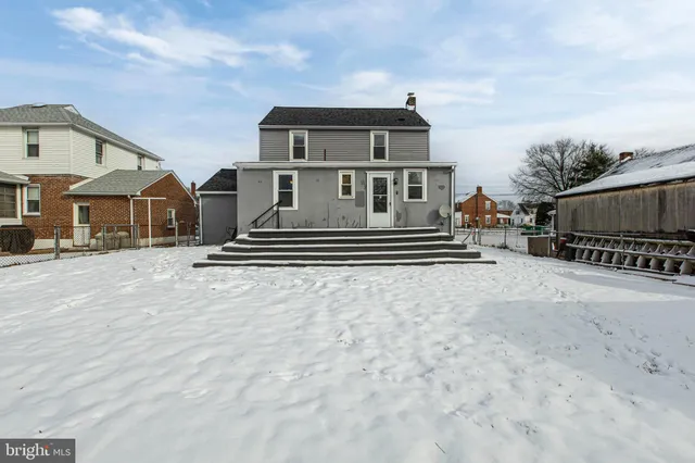 a front view of a house with a gate