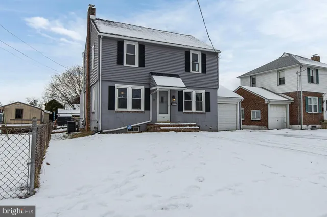 a front view of a house with parking space