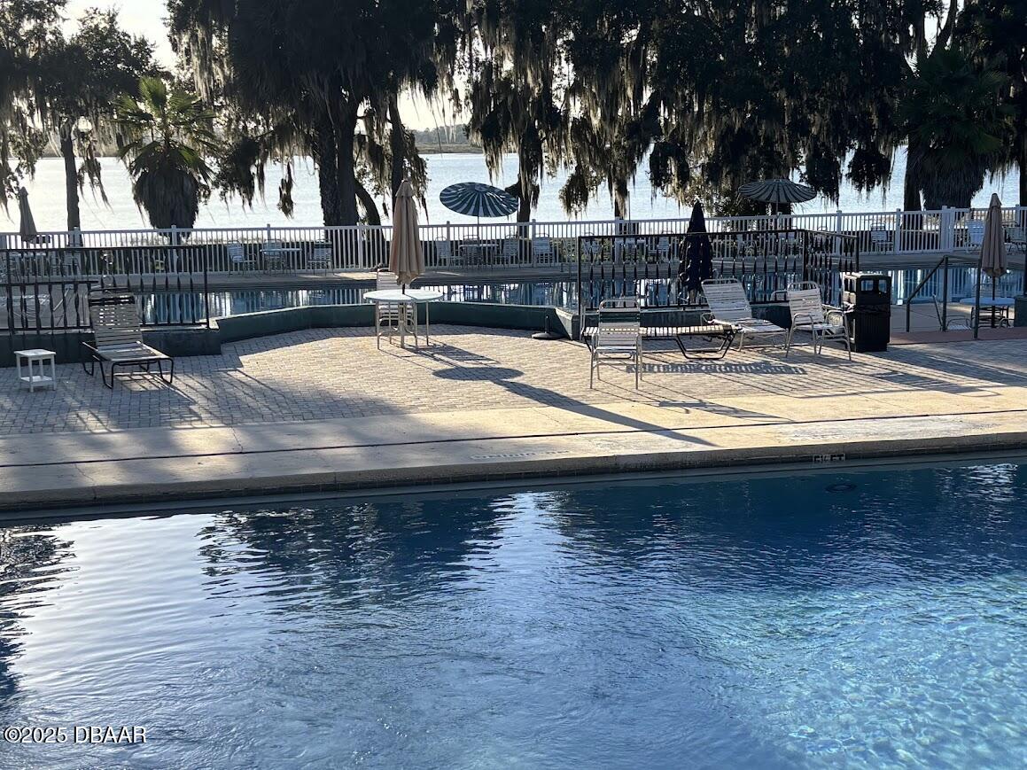 25161 Northeast 140th Loop Salt Springs, FL 32134 - Photo 35 of 45 a view of a swimming pool with an outdoor space