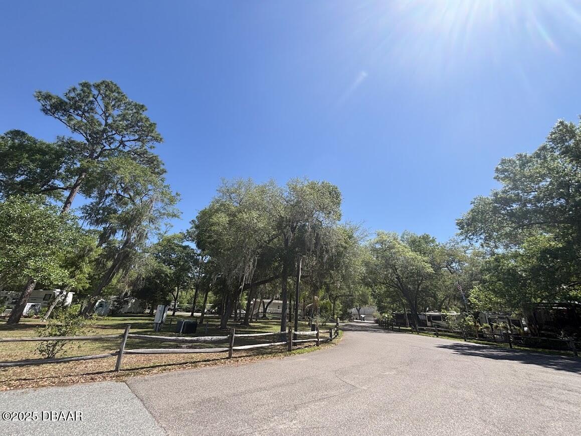 25161 Northeast 140th Loop Salt Springs, FL 32134 - Photo 45 of 45 a view of a bench in front of a building