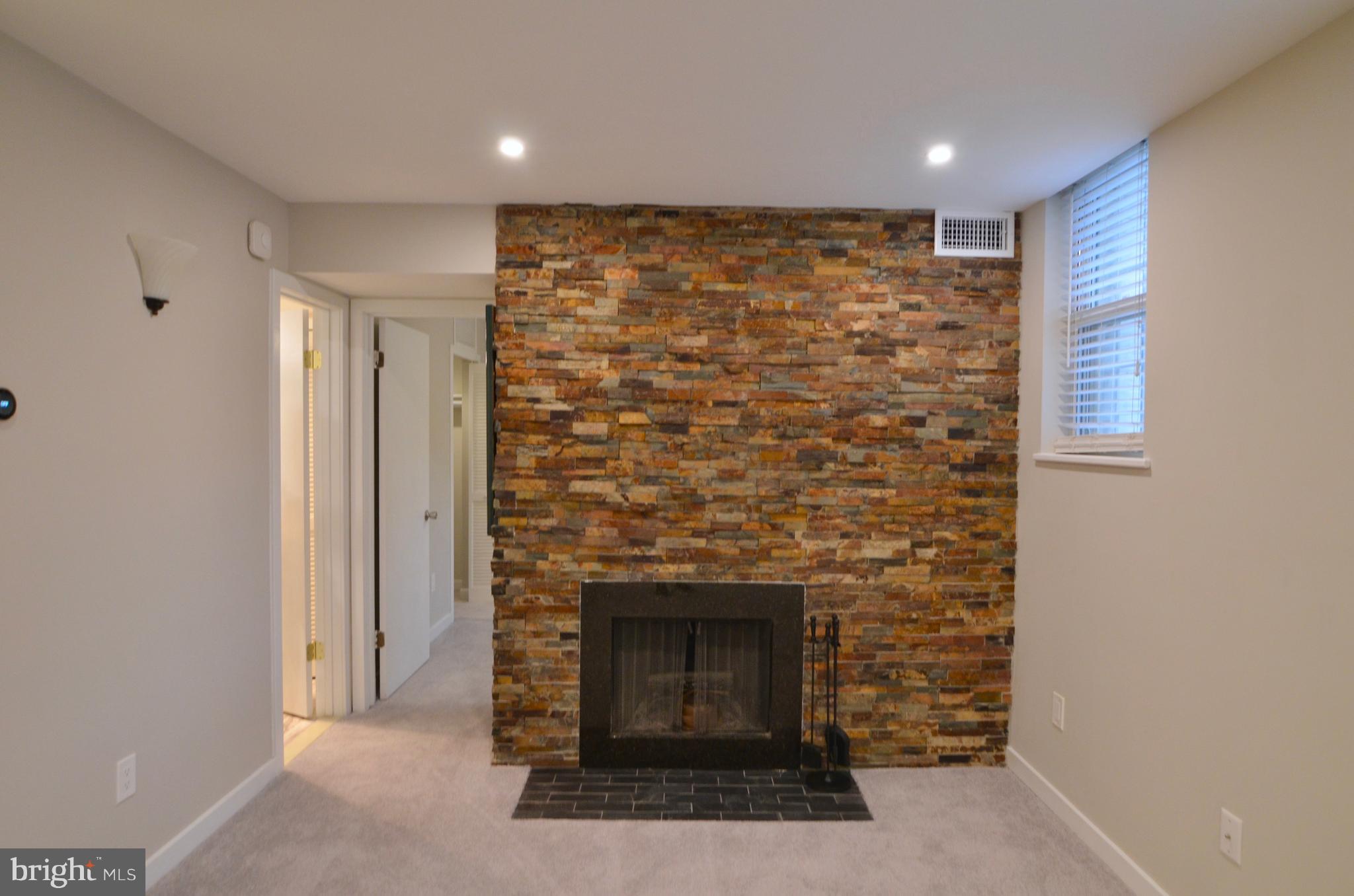 2114 N Street Northwest, Unit 2 Washington, DC 20037 - Photo 9 of 24 a view of empty room with a fireplace