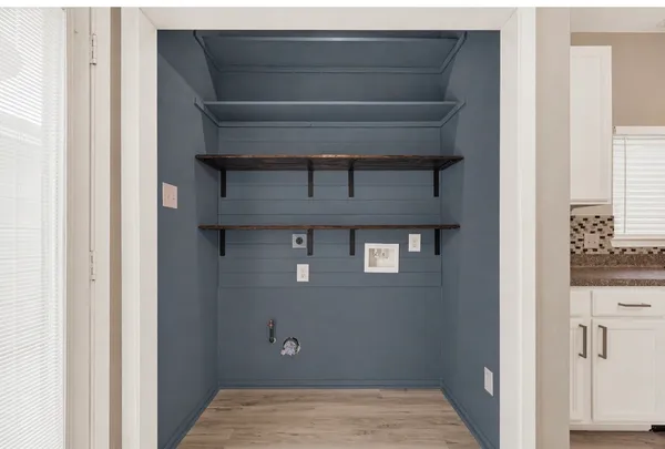 a view of an empty room with a ceiling fan