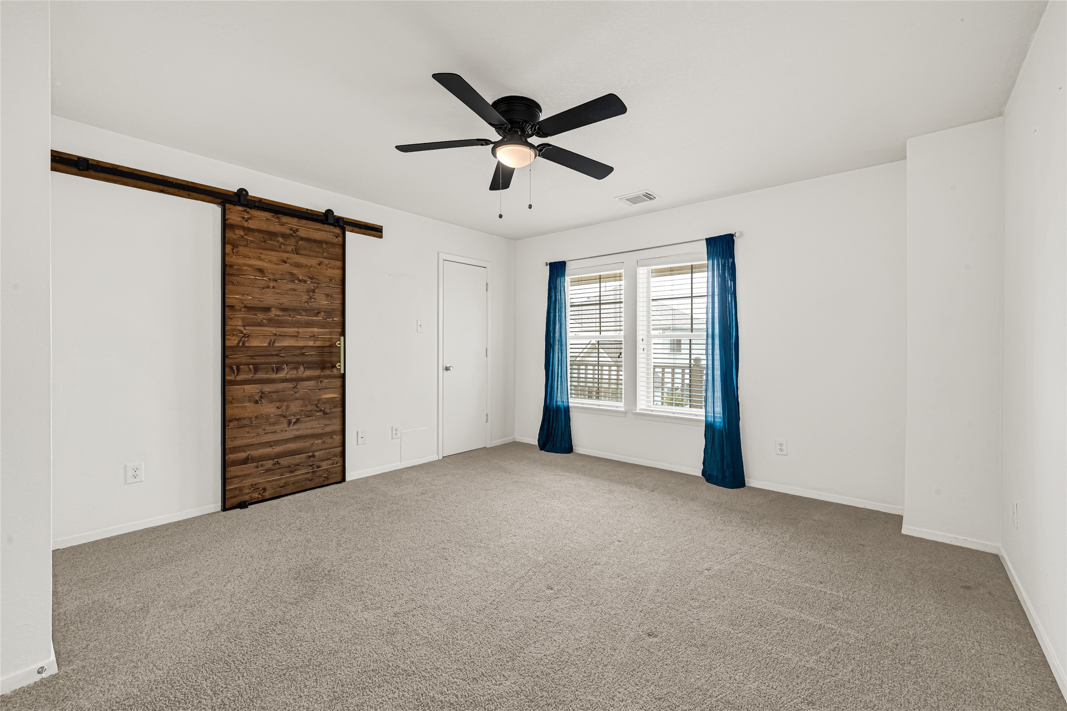 21831 Mossy Field Lane Spring, TX 77388 - Photo 15 of 26 a view of an empty room with a ceiling fan