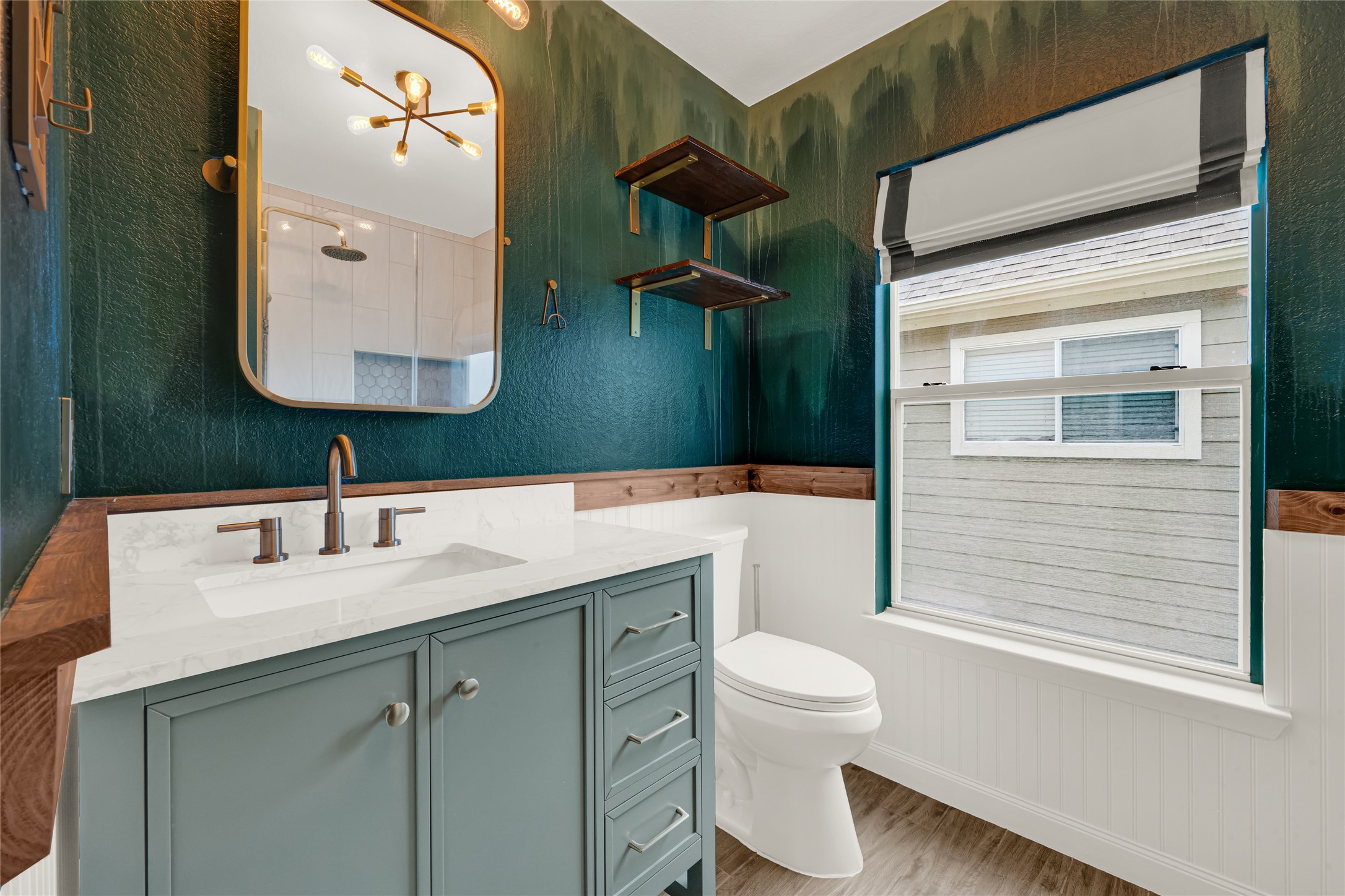 21831 Mossy Field Lane Spring, TX 77388 - Photo 18 of 26 a bathroom with a sink a toilet and a mirror