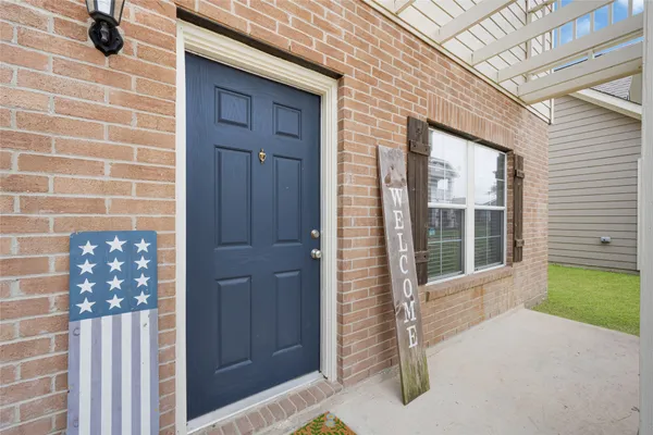 a view of front door of house with yard