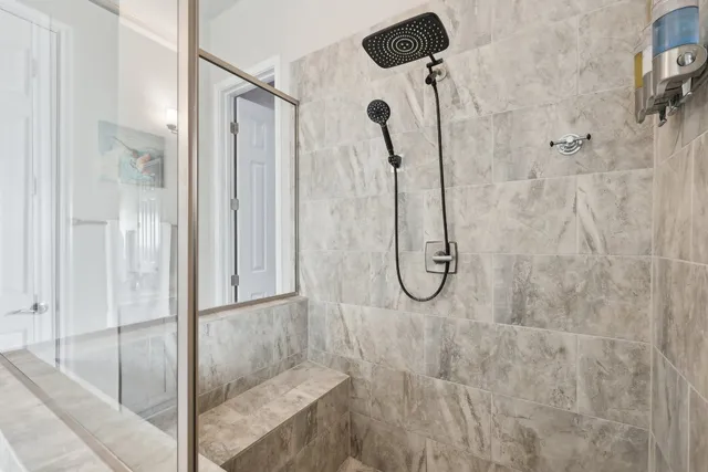 a bathroom with a glass shower door