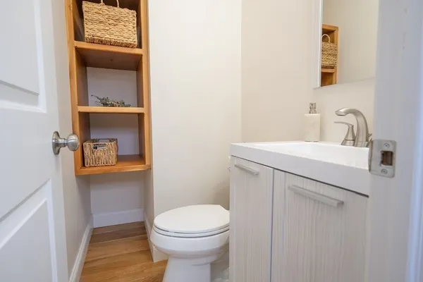 a bathroom with a sink a toilet and vanity