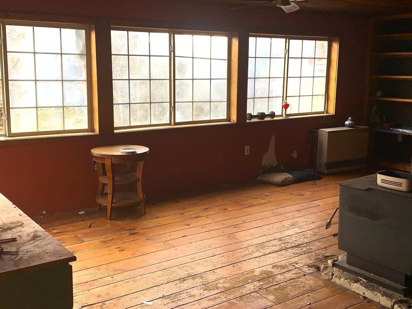 71 Williams Pond Road Bucksport, ME 04416 - Photo 23 of 33 Row of windows, Rinnai heater