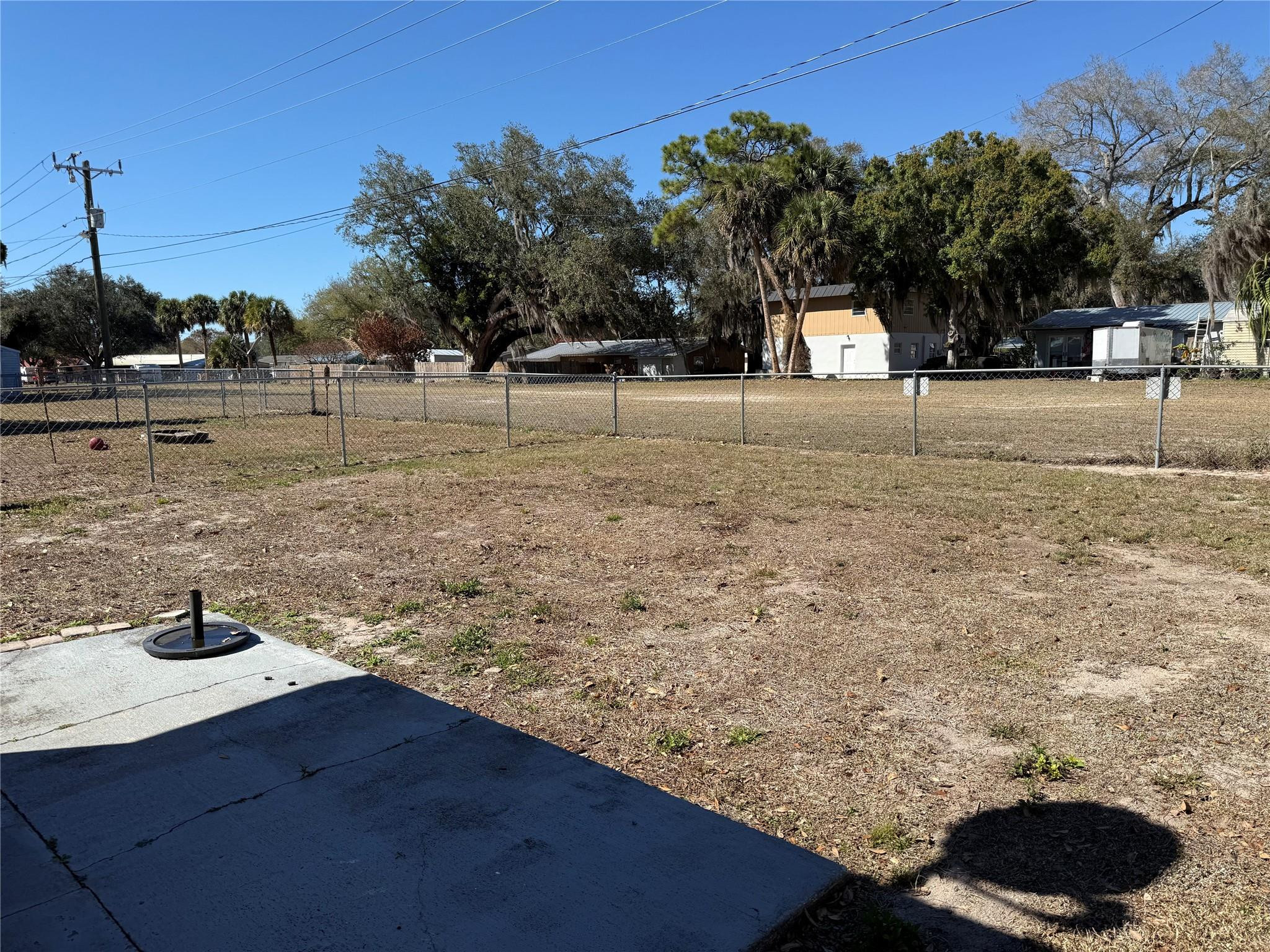 817 Southeast 9th Street Okeechobee, FL 34974 - Photo 13 of 13 a view of open area covered with trees