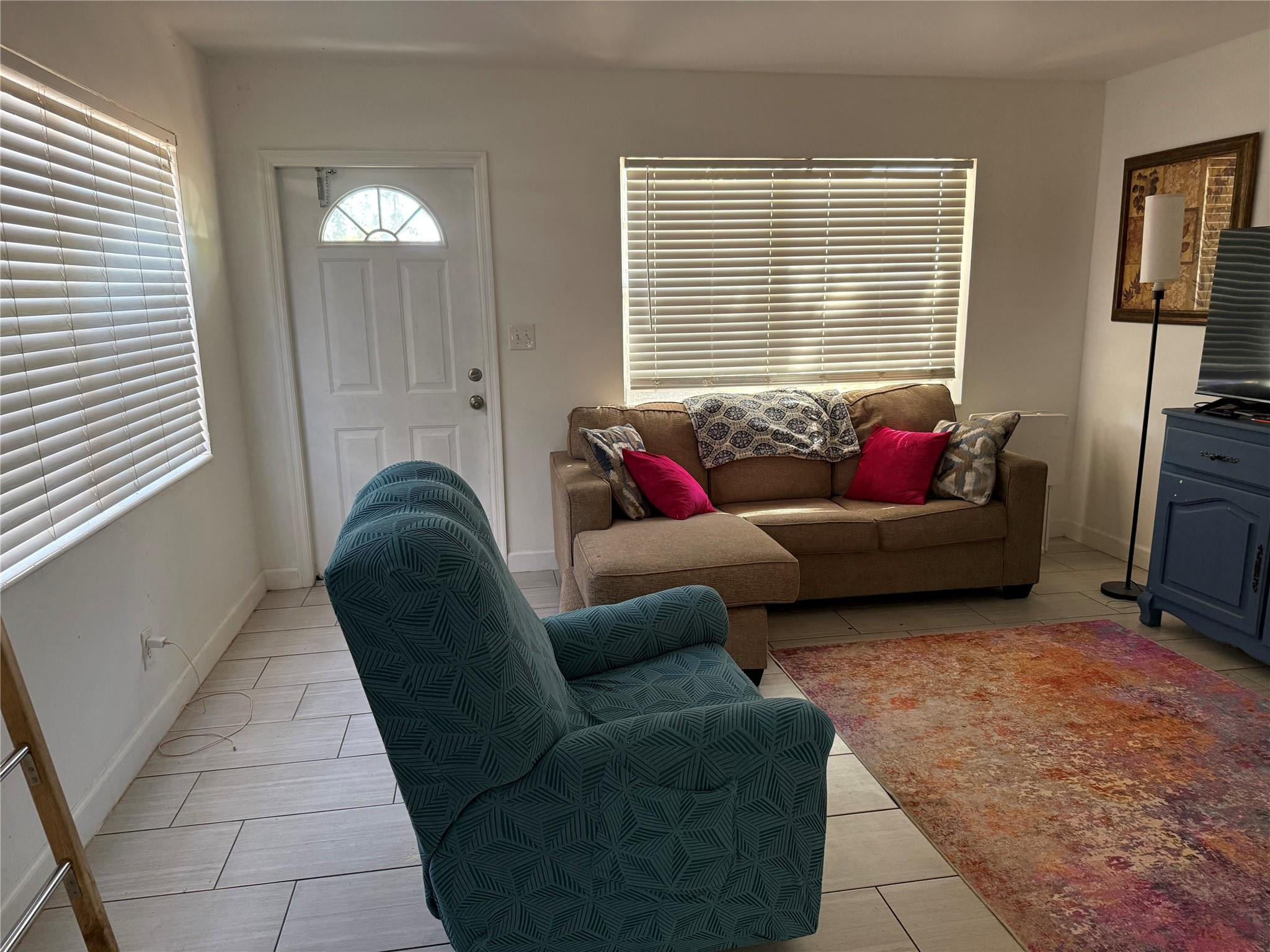 817 Southeast 9th Street Okeechobee, FL 34974 - Photo 9 of 13 a living room with furniture and a window