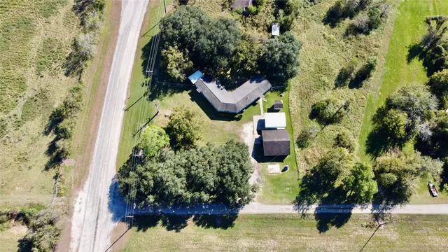 a balcony with lots of trees and flowers