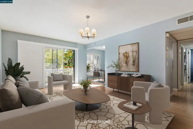 a view of a patio with a table and chairs under an umbrella