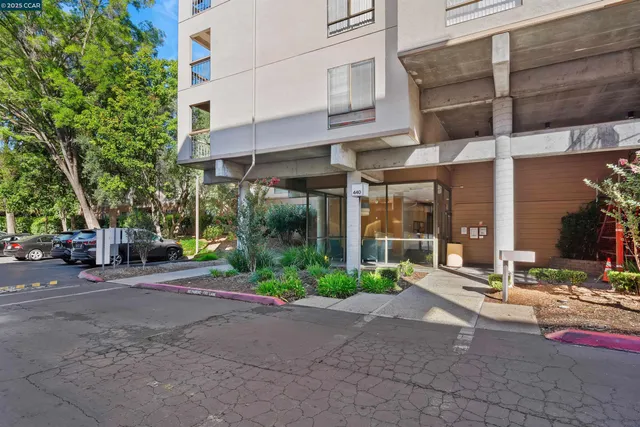 a outdoor space with the couches and dining table with wooden floor