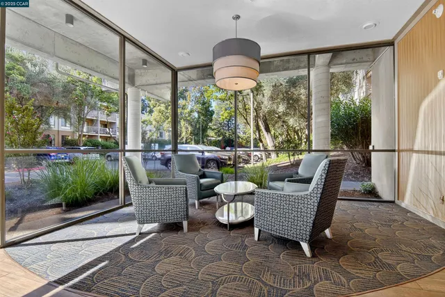 a view of a dining room with furniture window and outside view
