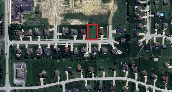 an aerial view of multiple houses with yard